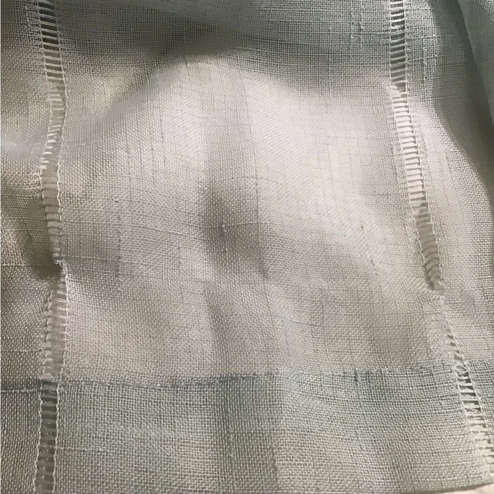 A total of 4 mint green 37 x 96 sheer Curtain panels with Bronze Grommets
